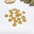 Macro detail of 18k gold-plated hollow petal bead caps for DIY jewelry making - Multi-Petal Hollow Flower Style (ZYN-AM19G)
