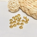 Close-up of 18k gold plated hollow flower bead caps for DIY jewelry making crafts - Bright Gold Flower Cap (ZYN-AM33G)
