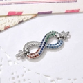 Macro detail of infinity jewelry connector with colorful micro-pave cubic zirconia crystals - Silver Infinity Connector (ZYN-DMK499-1)