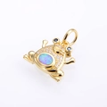 Detailed close-up of a copper frog pendant with inlaid opal and sparkling white zircon stones - Gold Tone Pink