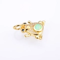 Detail of frog pendant with opal back, clear zircon stones, and blue eyes on gold plating - Golden White