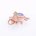 Macro view of rose gold frog pendant with oval blue opal and micro-pave crystals - Rose Gold Pink