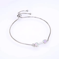Detail of box chain bracelet with dumbbell pendant featuring pink opal inlay stones - Platinum Pink Opal Bracelet