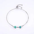 Macro shot of adjustable silver box chain with green opal dumbbell pendant - Platinum Green Opal Bracelet
