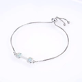 Macro detail of adjustable box chain bracelet featuring square opal stones in silver setting - Platinum White Opal Bracelet