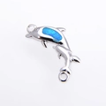 Macro shot of silver dolphin connector with blue opal inlay for DIY jewelry making - Double Dolphin Style / Silver Blue Dolphin