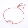 Detail of rose gold dolphin bracelet with opal inlay and adjustable sliding clasp - Double Dolphin / Rose Gold/White