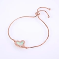 Detail of rose gold heart bracelet with opal inlay, cubic zirconia, and adjustable box chain - Rose Gold White Opal