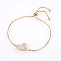 Macro shot of gold adjustable box chain bracelet with heart opal and zircon inlay - Gold Pink Opal