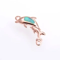 Détail du connecteur dauphin en or rose avec incrustation d'opale bleue pour bijoux - Or Rose Vert Dauphin