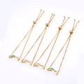 Detailed view of four adjustable gold-tone dolphin bracelets with colorful opal inlays - Gold Mixed Opal
