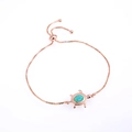 Detailed view of adjustable rose gold turtle bracelet with blue opal and box chain - Green Turtle / Rose Gold