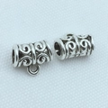 Macro shot of antique silver cylindrical spacer beads with intricate hollow scrollwork detail - 11x7 Cylindrical Style 2 / 100pcs Pack