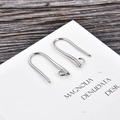 Detailed view of silver U-shaped earring hooks for DIY jewelry making on wood background - U-Shape Bright Metal Style / Silver (kk05-p)