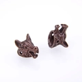 Macro detail of antique bronze wolf head alloy charms for DIY jewelry making - Antique Red Copper