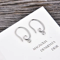 Detail shot of silver S-shape spiral earring hooks for DIY jewelry making on wooden background - Silver (kk06-p)