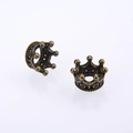 Detailed macro view of vintage bronze alloy crown charms for DIY jewelry making and accessories - Cyan Bronze
