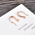 Close-up of rose gold U-shaped ear wires for DIY jewelry making on a wooden background - Rose Gold (kk07-r)