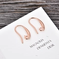 Close-up of rose gold U-shaped DIY earring hooks on display card for jewelry making - Rose Gold (kk08-r)