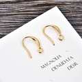 Macro shot of gold-plated U-shaped earring hooks with closed loop for DIY jewelry making - Gold (kk13-g)