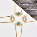 Gros plan de bracelets mauvais œil réglables avec opale et zircon en quatre couleurs - Bracelet Oeil Or Jaune