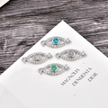 Detailed view of silver evil eye opal connectors for DIY jewelry making sets - Blue Opal Connector / White Gold Evil Eye