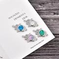 Hamsa Hand charms with opal and cubic zirconia stones on dark wood background - Connector (Blue Opal) / Platinum Hamsa Hand
