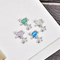Polished silver turtle pendant with opal shell inlay in green, white, purple, and blue - Blue Opal / White Gold Dual Turtle