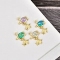 Four gold plated sea turtle pendants featuring opal shells in purple, green, blue and white - Blue Opal / Yellow Gold Dual Turtle