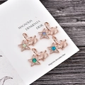 Detail of copper plated turtle and starfish pendants with opal and zircon inlays - Rose Gold Star with Turtle