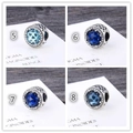 Macro detail of S925 sterling silver charms with sparkling blue zircons and heart patterns - Star Shape (S011-5-1)