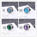 Macro detail of S925 silver charms with colorful zircons and heart hollow pattern - Deep Blue Gem (S011-9-1)