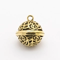 Macro shot of golden filigree hollow ball pendant for handmade jewelry making - Hollow Sphere Pendant / Antique Gold