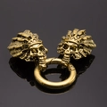Antique gold skull head charms with feathered crowns on a metal spring ring clasp - Antique Gold