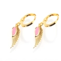 Detailed close-up of gold-plated hoop earrings with pink enamel angel wing pendants - Gold Tone Pink