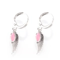 Detail of silver angel wing earrings with pink teardrop enamel and textured feathers - Silver Tone Pink