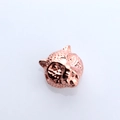 Macro detail of a rose gold leopard head bead for DIY jewelry making and bracelet charms - Antique Rose Gold