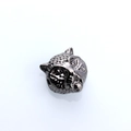 Macro detail of leopard head metal bead with textured spots for DIY jewelry making - Gun Black