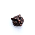 Detailed macro view of leopard head metal bead with vintage bronze finish for jewelry DIY - Antique Red Copper