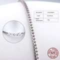 Close-up of 1.5mm S925 sterling silver box chain necklace with lobster clasp detail - 925 Silver / Box Chain