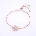 Rose gold adjustable fish bracelet with teardrop opal inlay and secure sliding clasp - Rose Gold Tone White Tropical Fish Opal