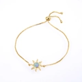Adjustable golden bracelet featuring a sun-shaped pendant with blue opal and zircons - Gold Tone Pink Sun/Starfish Opal