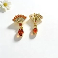 Detail view of gold fan-shaped earrings with orange stones and zircon inlays - Red Pendant