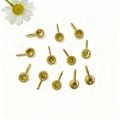 Macro detail of twelve gold-plated round zircon settings for DIY jewelry making - Gold Yellow