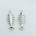 Macro detail of fishbone pendants in silver finish with opal stone inlays for DIY jewelry - Platinum + White Opal (Connector Only)