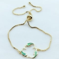 Detail view of gold dolphin charm bracelet with green opal inlay and adjustable sliding clasp - Green Opal Gold Plated