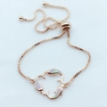 Detail of rose gold dolphin bracelet with opal inlay and adjustable bolo slide clasp - Pink Opal Rose Gold Plated
