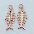 Detailed view of rose gold fishbone pendants with iridescent opal inlay on white surface - Rose Gold / Pink (Pendant Only)