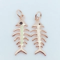 Detail view of gold-plated fishbone pendants with opal inlay and rose gold finish - Rose Gold / White (Pendant Only)