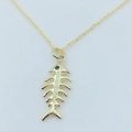 Detailed close-up of a gold-plated fishbone pendant featuring opal inlay and black stone eye - Gold / White (With Chain)